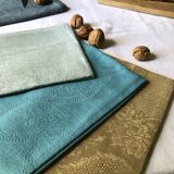 Suite of four tinted antique napkins