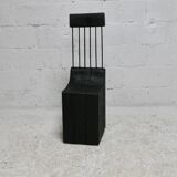 Brutalist chair, black-stained raw wood, steel. Work from the 1970s