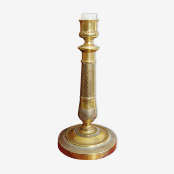 Candle holder in chiseled brass of the nineteenth century