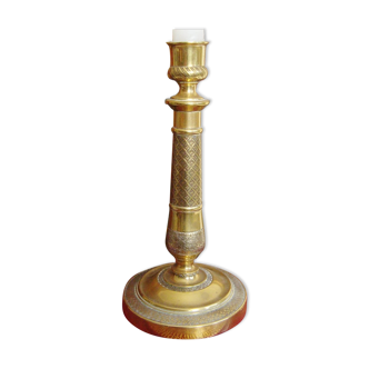 Candle holder in chiseled brass of the nineteenth century