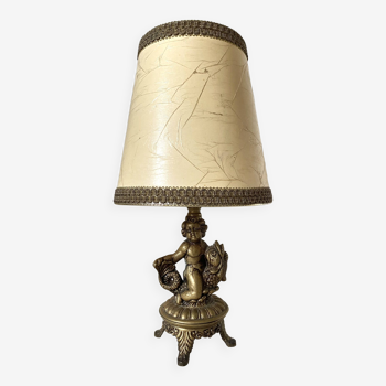 Retro brass cherub and fish lamp