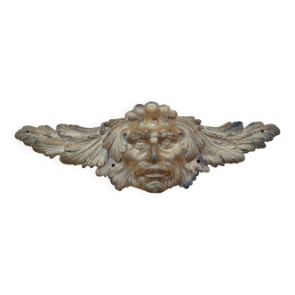 Fronton en bronze figurant un visage