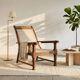 Vintage armchair in solid wood and geometric weaving – lodge spirit