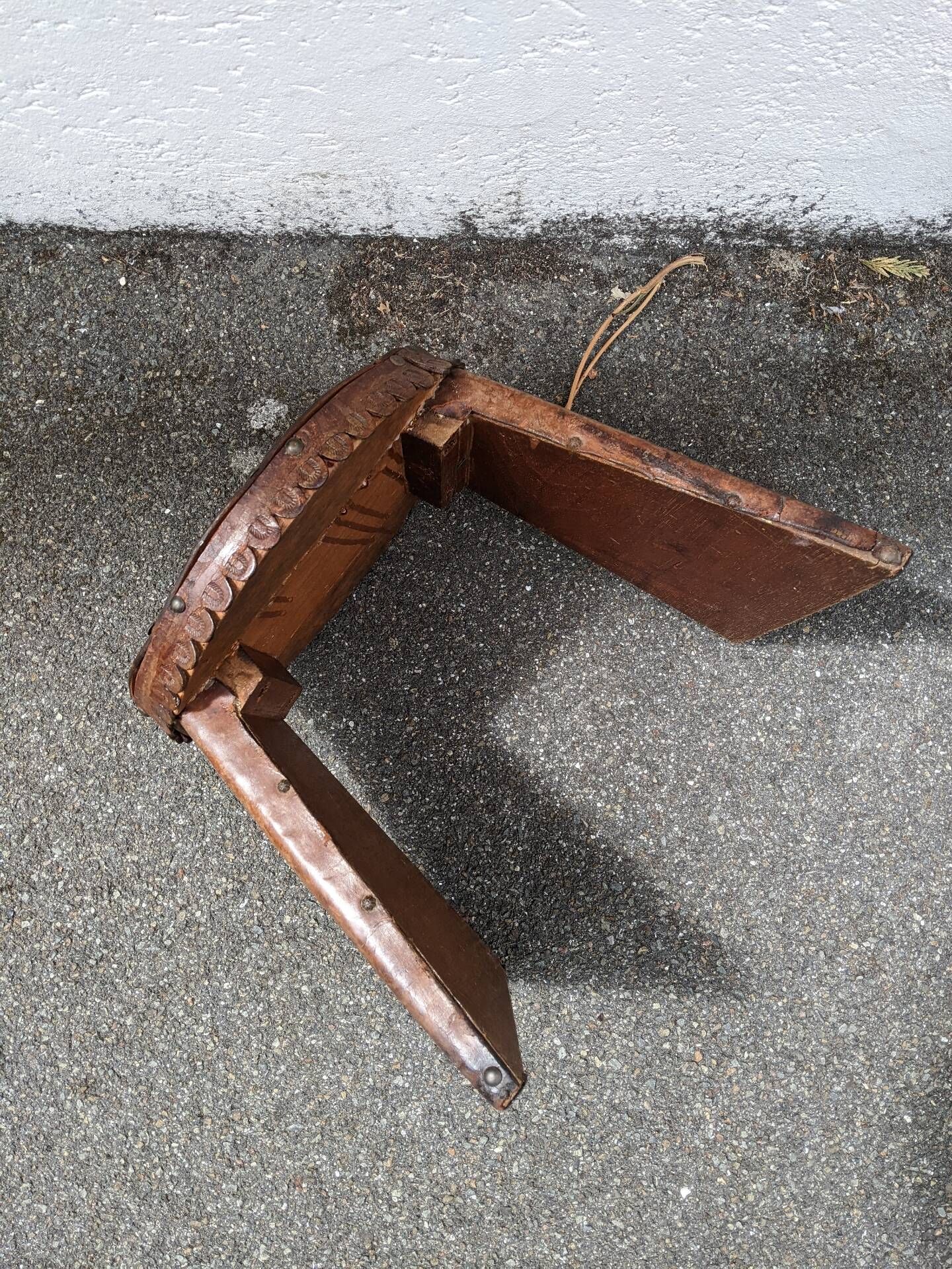 Wood and leather stool, handcrafted African art.