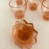 Service with vintage liqueur in pink rosaline glass