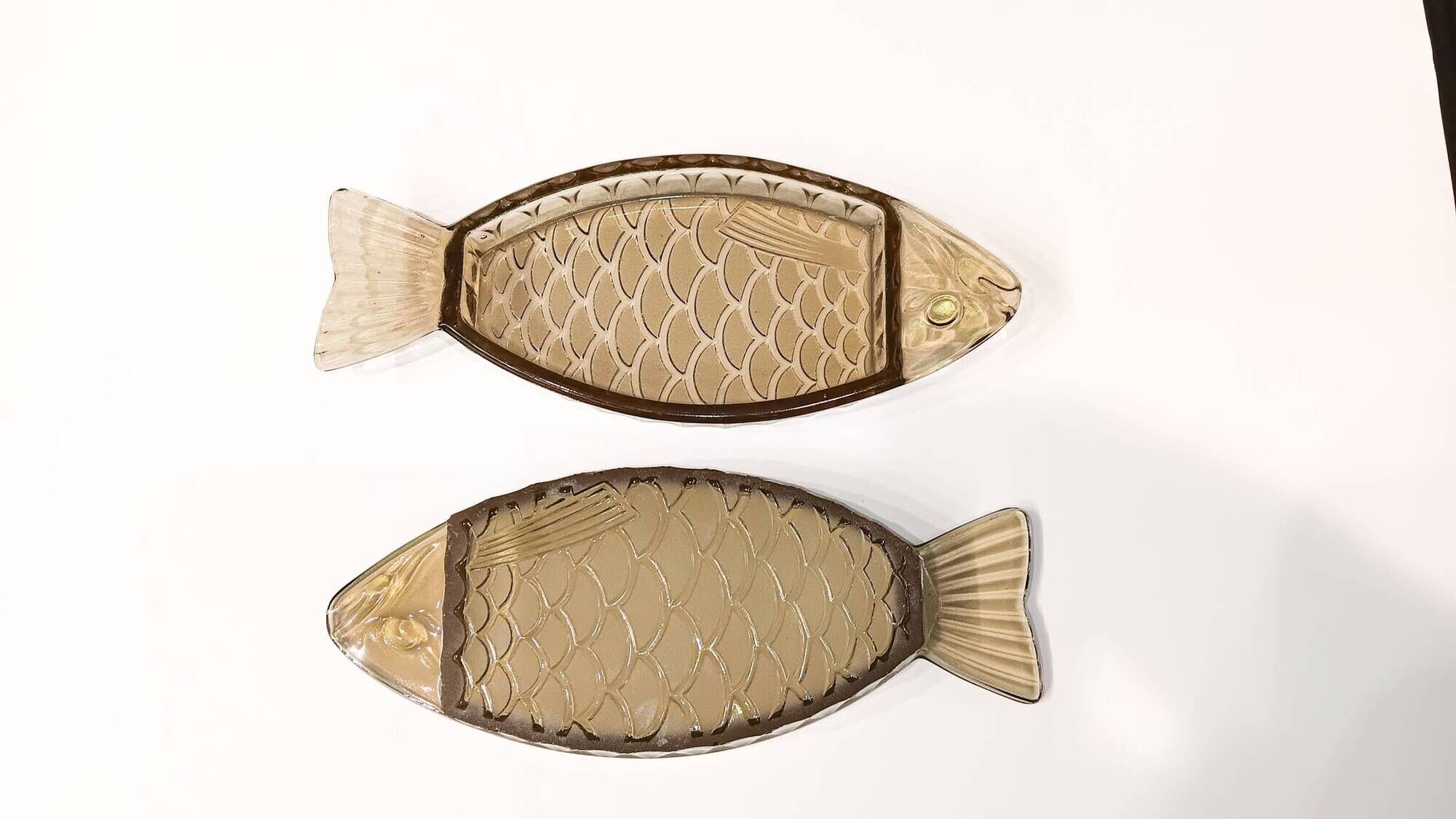 Set of 2 transparent smoked glass bowls in the shape of a fish.