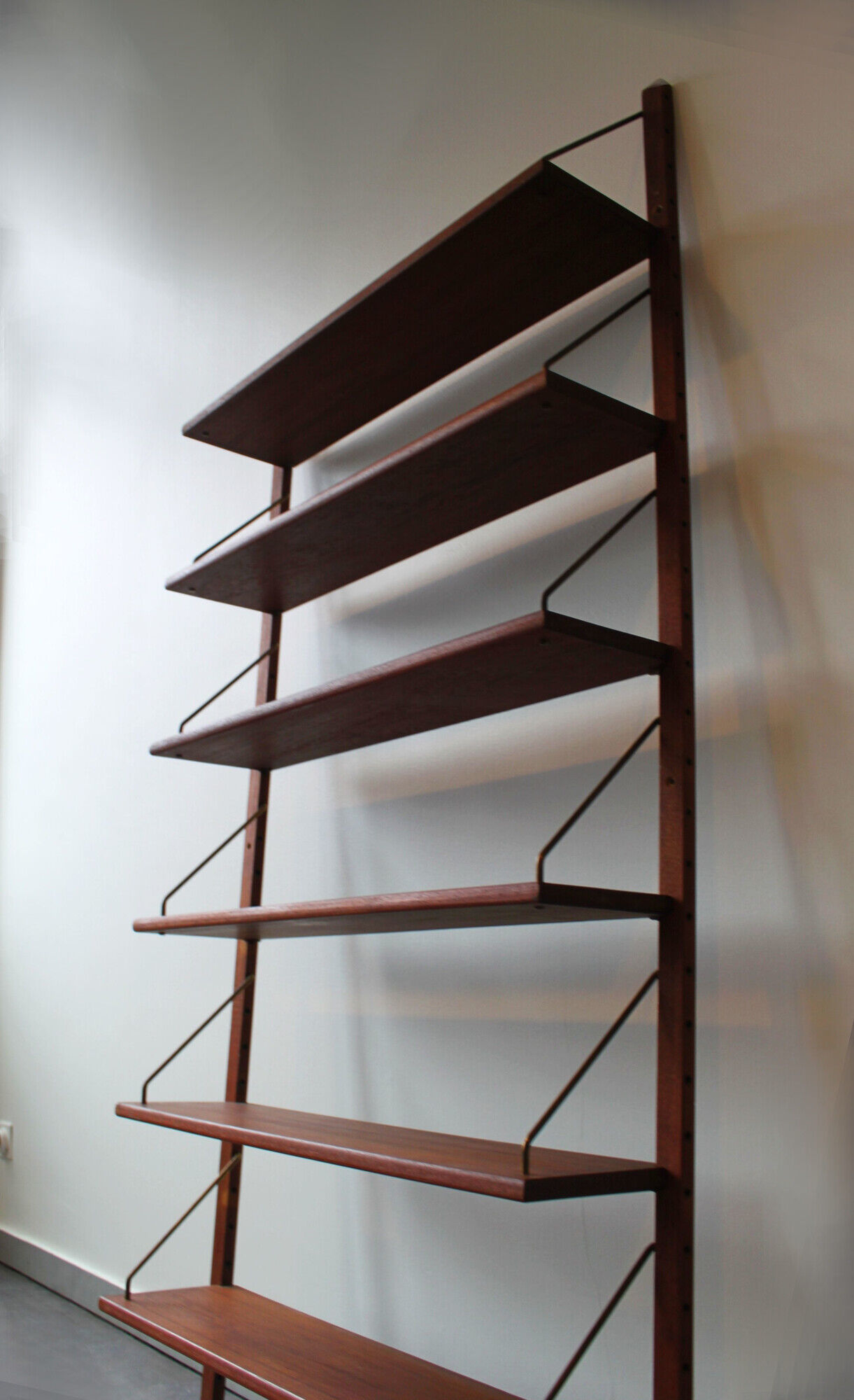 Teak and brass wall shelf by Poul Cadovius for Royal System, Denmark, 1960.