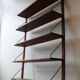 Teak and brass wall shelf by Poul Cadovius for Royal System, Denmark, 1960.