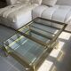 Vintage 1970s coffee table brass chrome Maison Jansen style with a top cover.