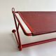 Vintage perforated red metal shelf