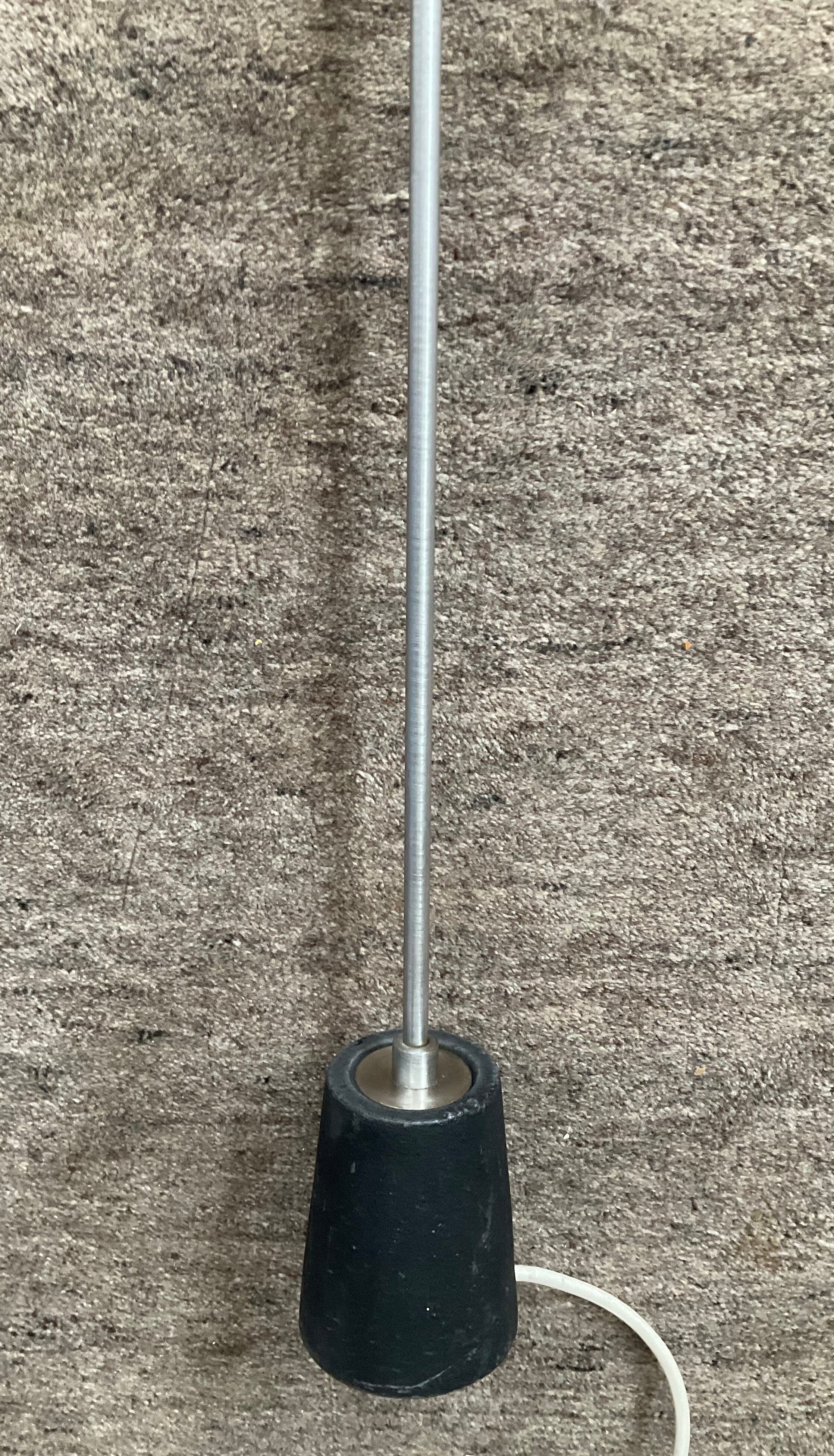 Minimalist floor lamp in cast iron and chrome metal