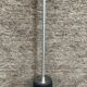 Minimalist floor lamp in cast iron and chrome metal