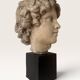 Plaster bust on a wooden base