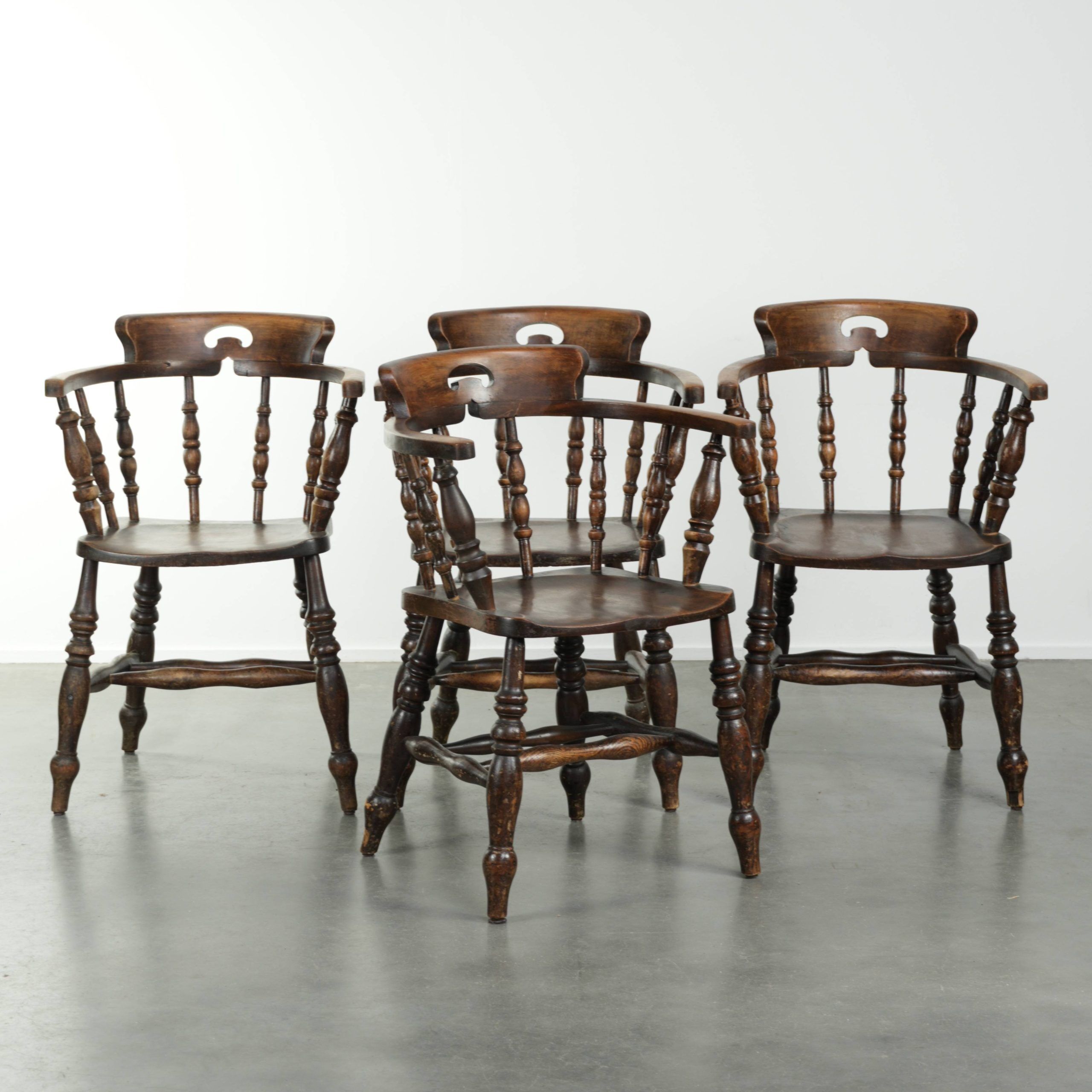 Set of four wooden English antique pub/captain chairs from the 19th century