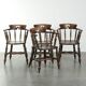 Set of four wooden English antique pub/captain chairs from the 19th century