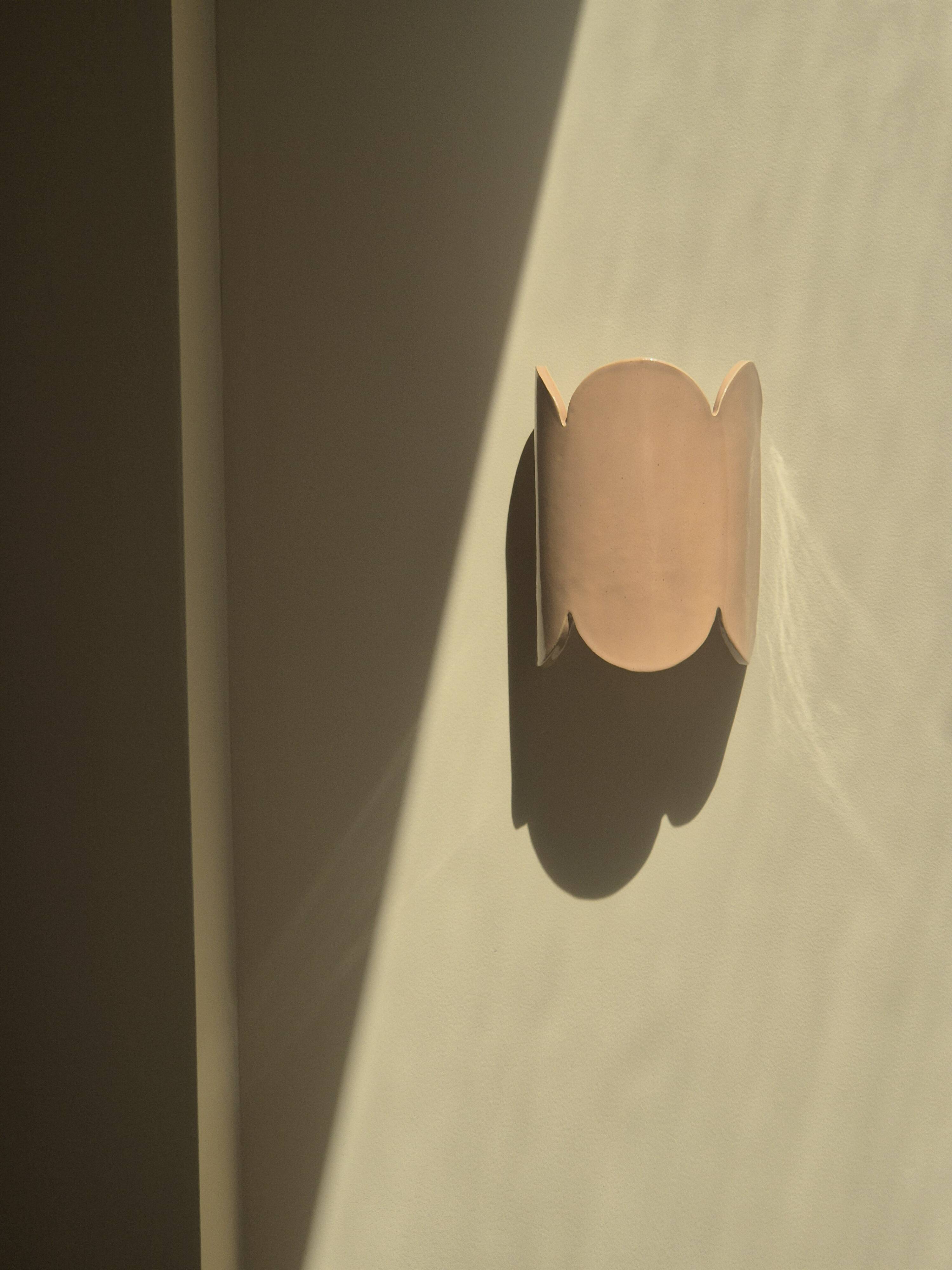 Mocha enamelled stoneware wall light (small model).