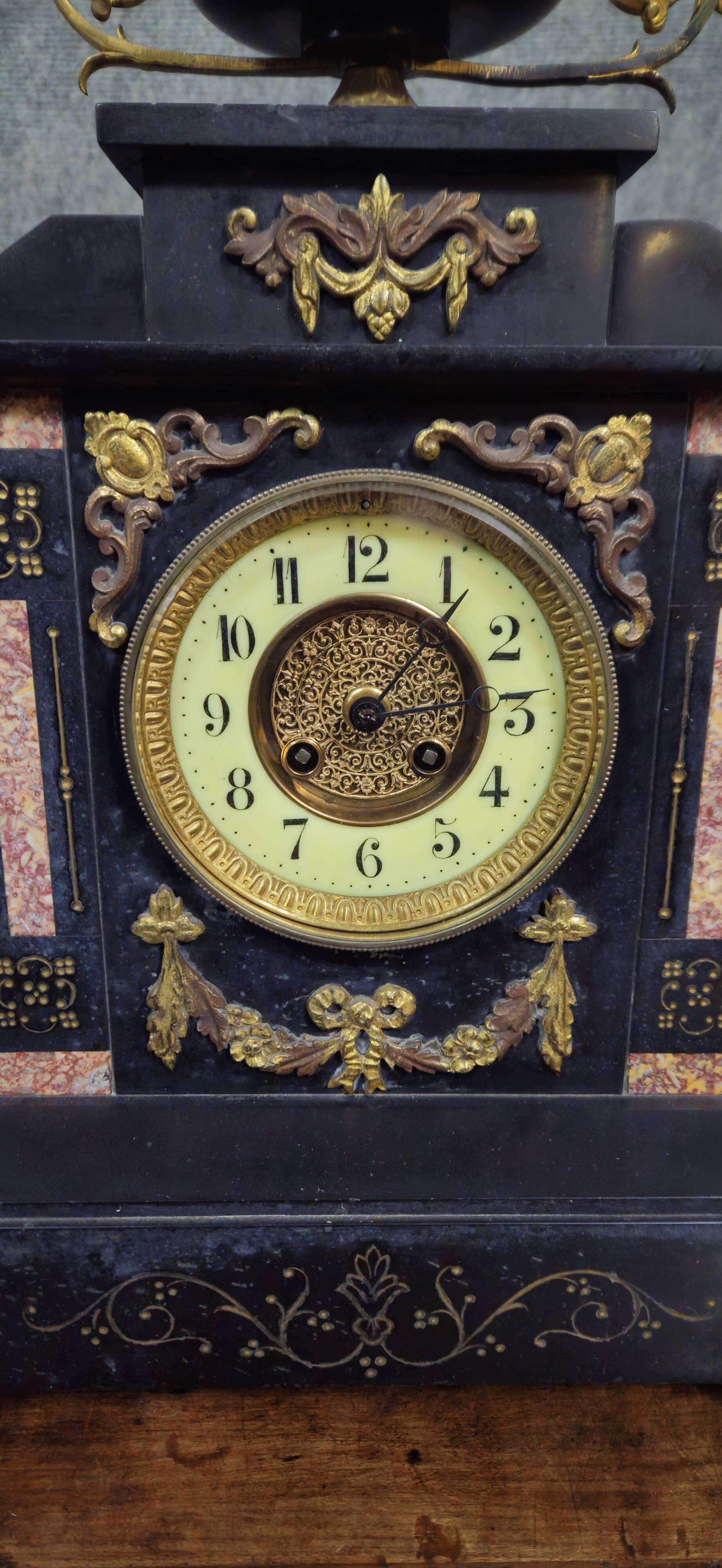 Large notary clock in black marble and gilded bronze.