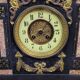 Large notary clock in black marble and gilded bronze.