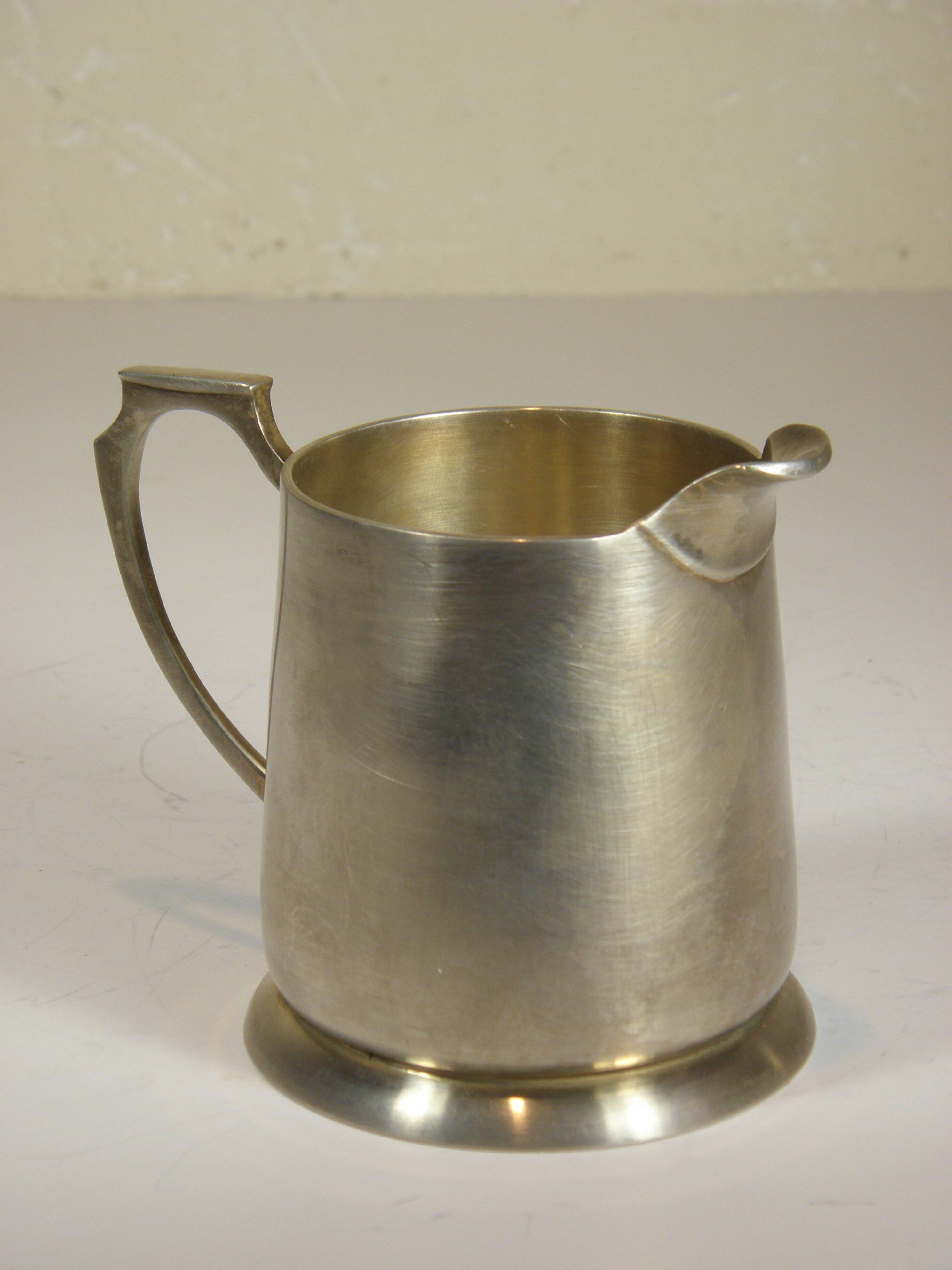 Silver-plated metal coffee pot and milk jug
