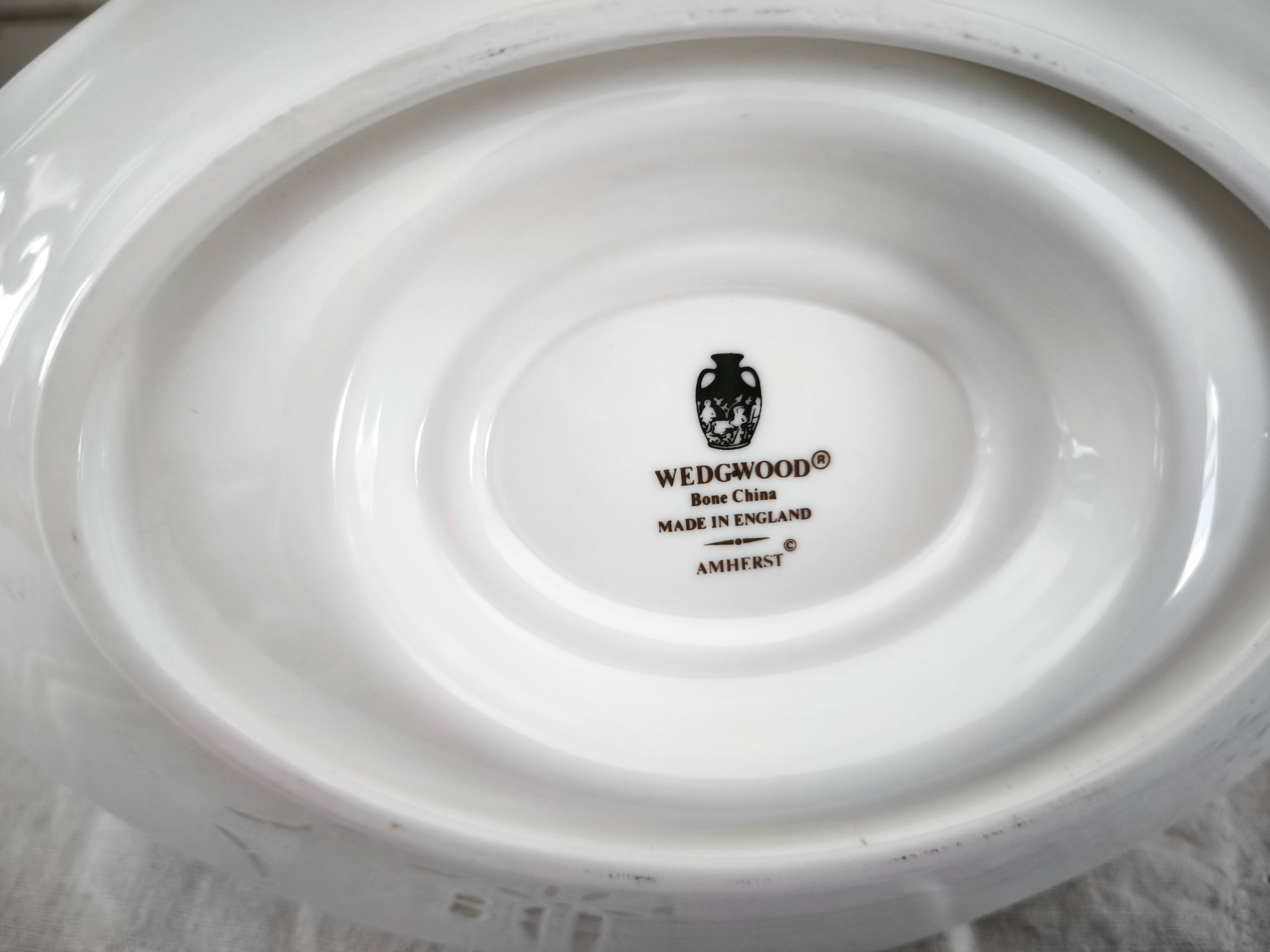 Sauce boat on a porcelain base in English Wedgwood model Amherst.
