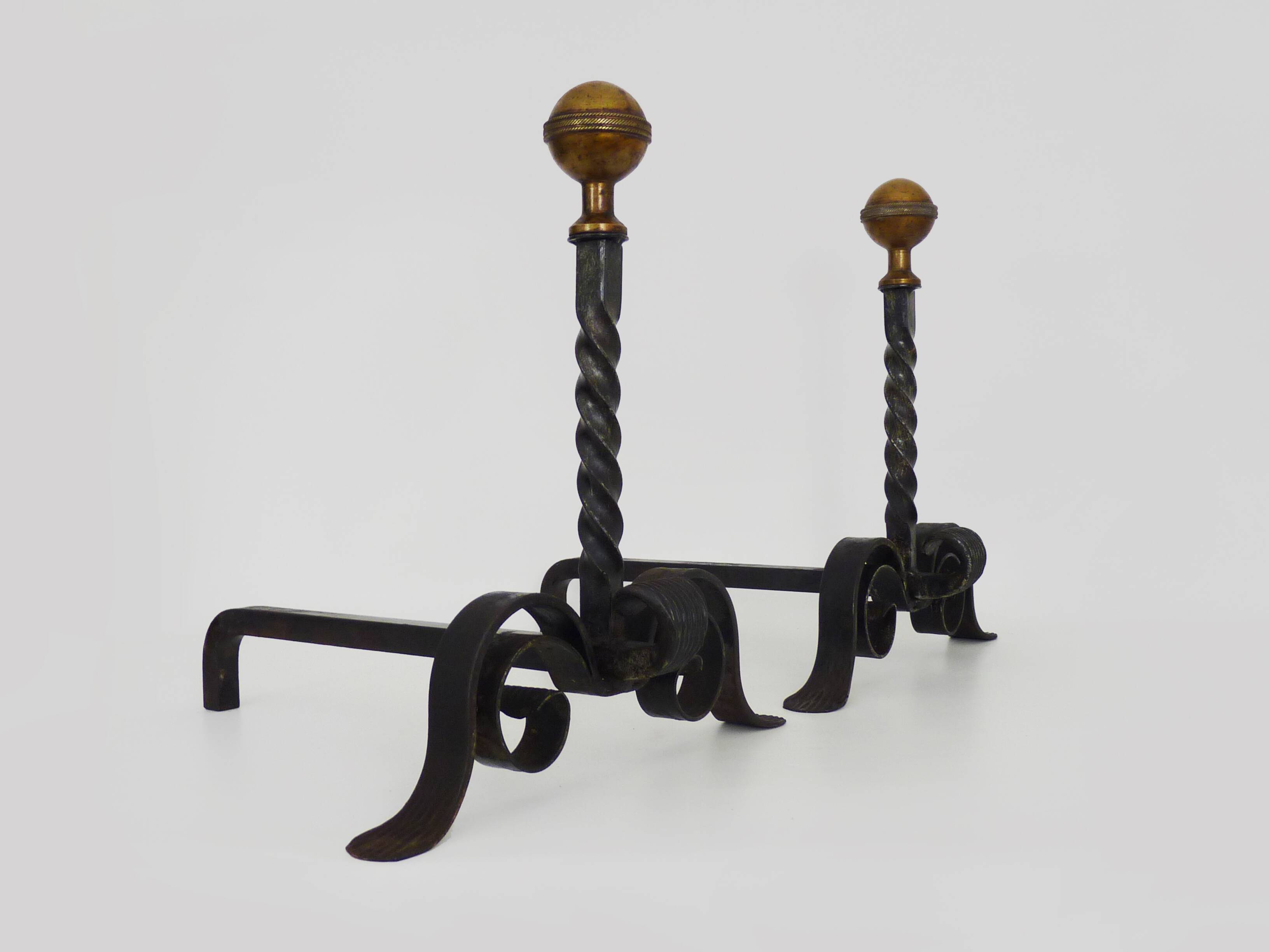 Large pair of wrought iron and brass ball fireplace andirons. 19th century