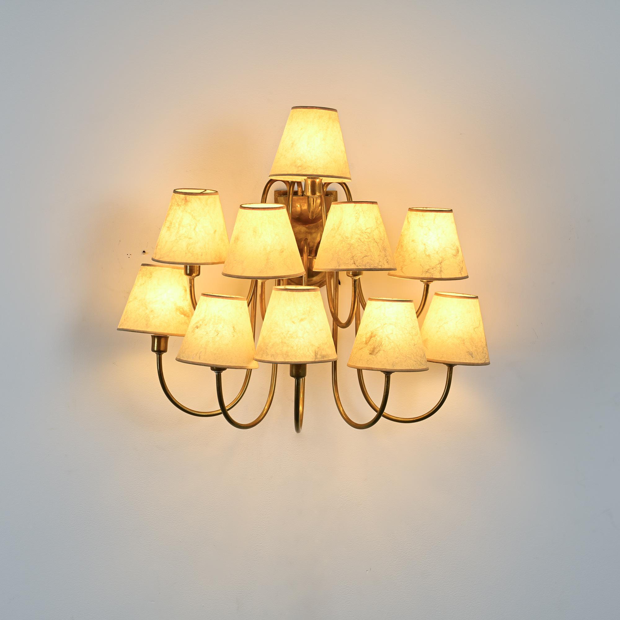 Wall sconce with nine arms in brass, France, circa 1950.