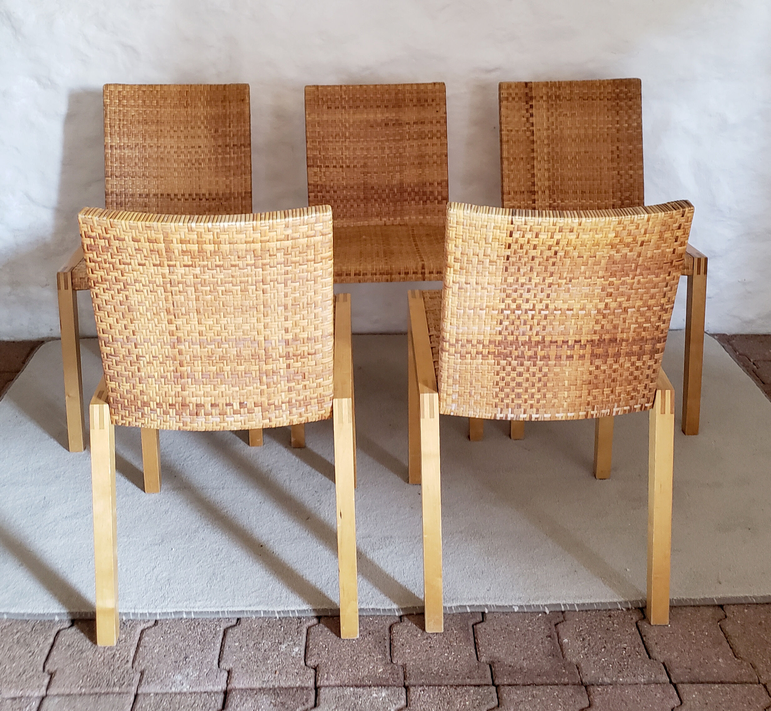 5 wooden and rattan chairs