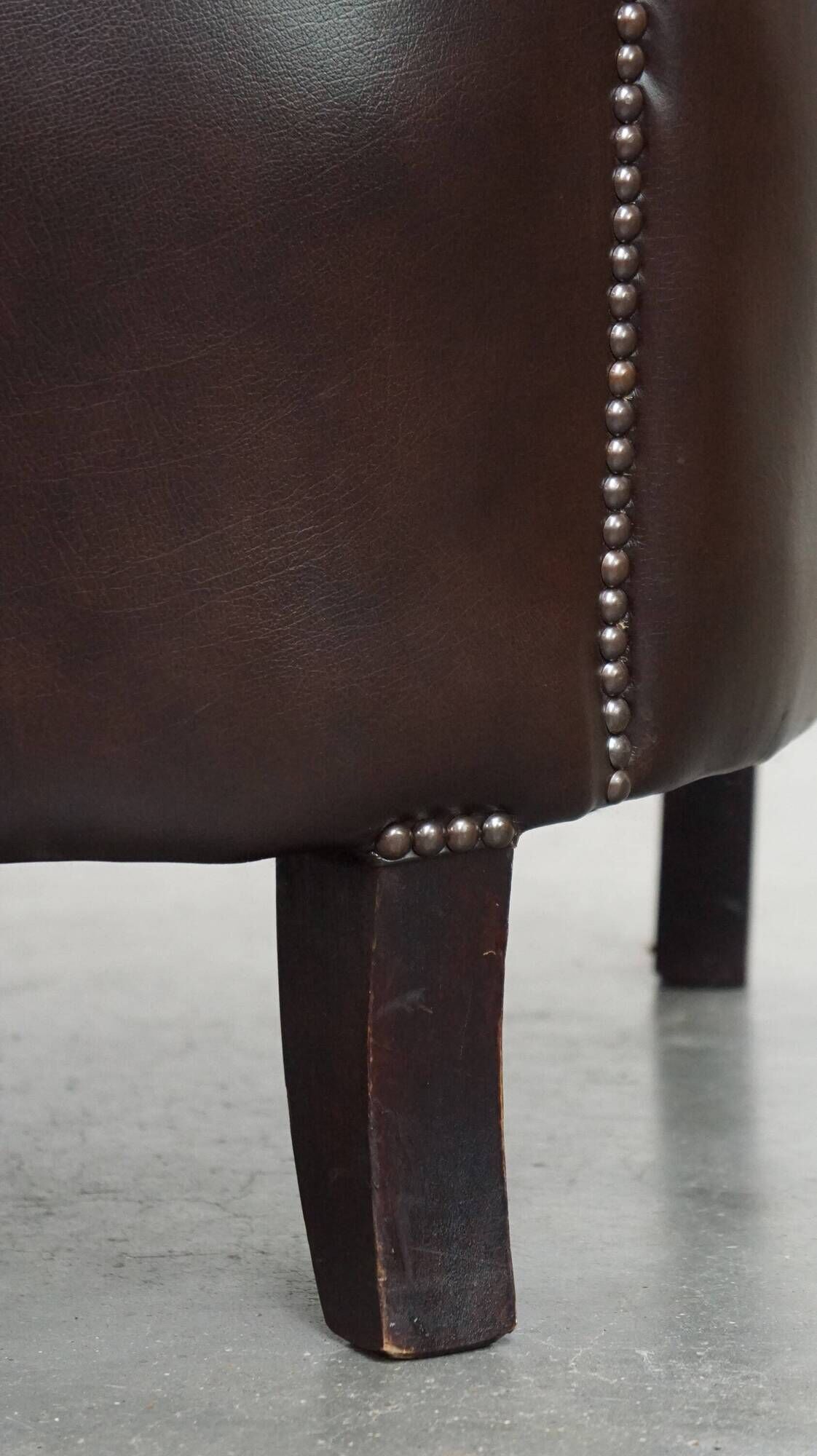 dark cowhide club chair in English style