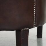 dark cowhide club chair in English style