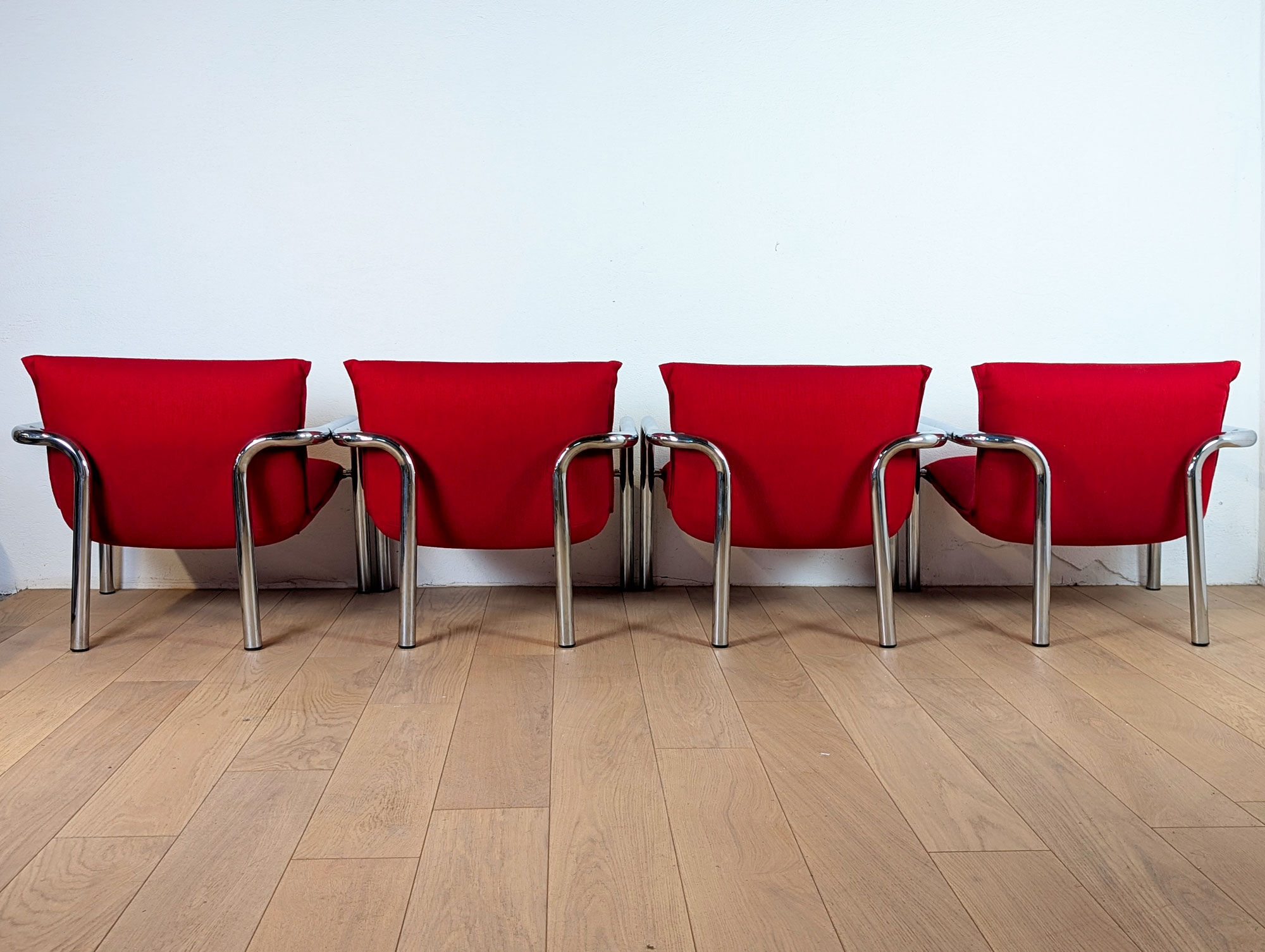 Pair of Italian armchairs in chromed metal and red fabric, 1970