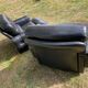 Pair of black imitation leather armchairs