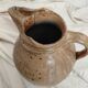 Old farm jug in glazed stoneware