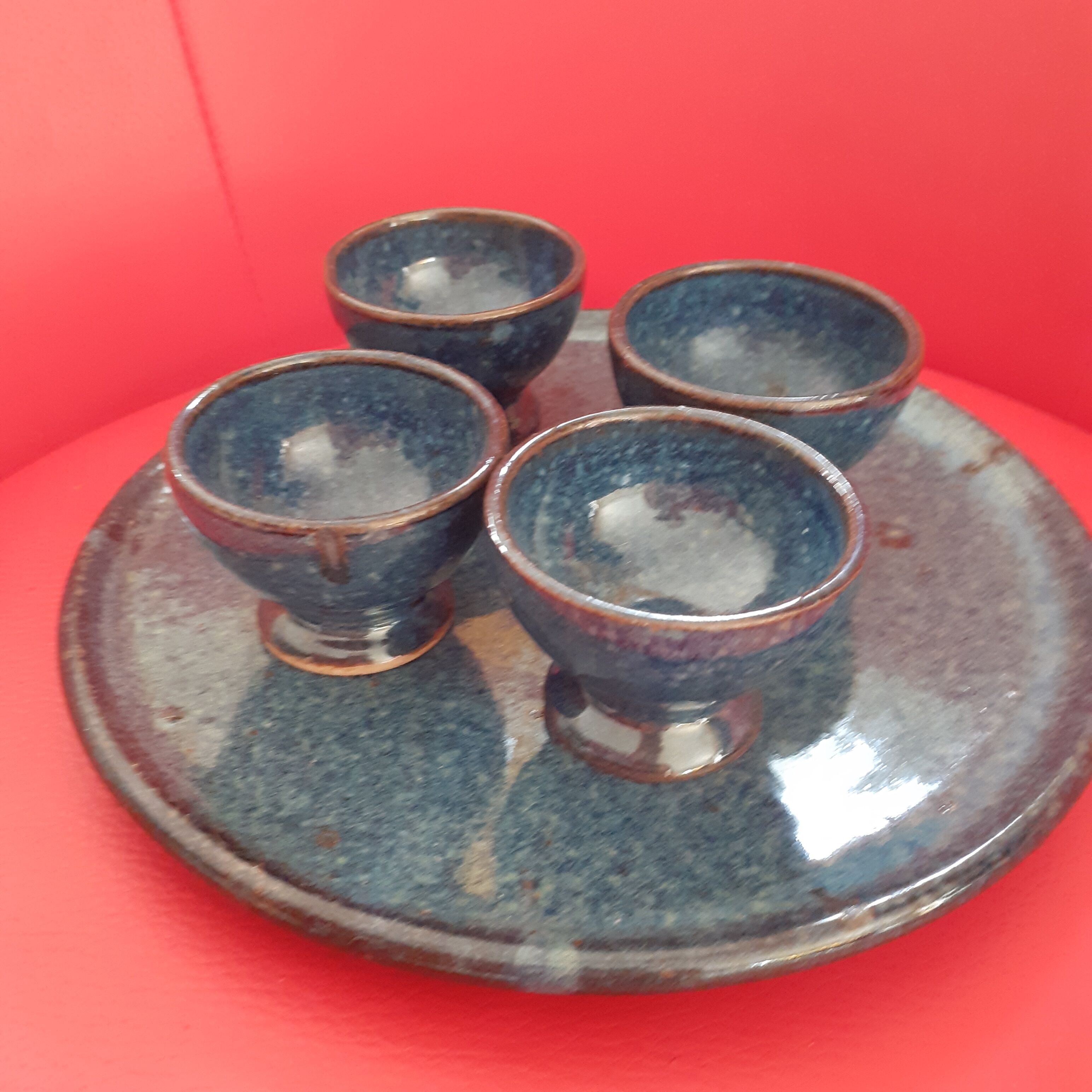4 coquetiers on their midnight blue sandstone plate.