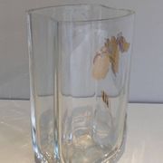 Glass vase with a decoration of a golden flower, around 1970.