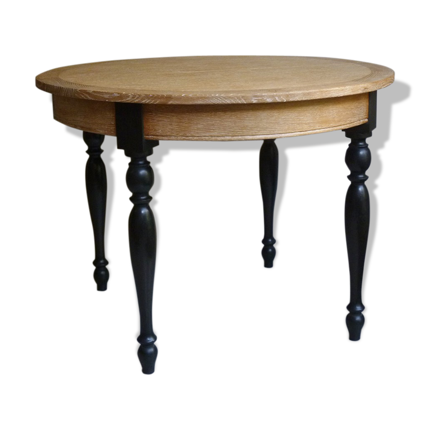 Round table in coloured cerused oak, waxed coloured feet