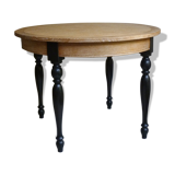 Round table in coloured cerused oak, waxed coloured feet