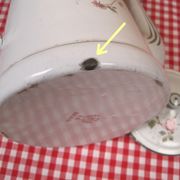 Old coffee maker in enamelled sheet metal brand bb 1900s , decoration of roses , kitchen utensils
