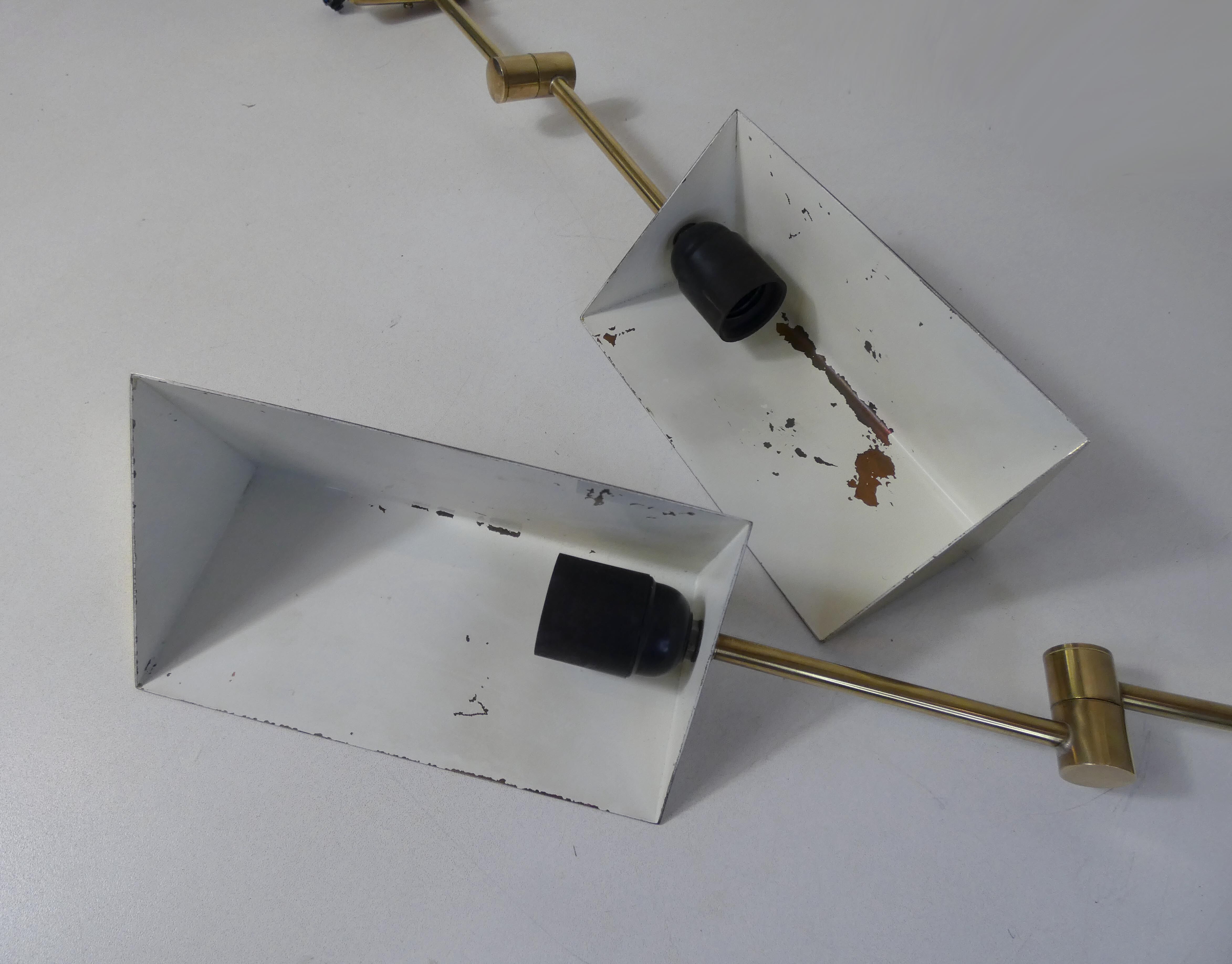 Pair of adjustable brass wall lamps after koch & lowy