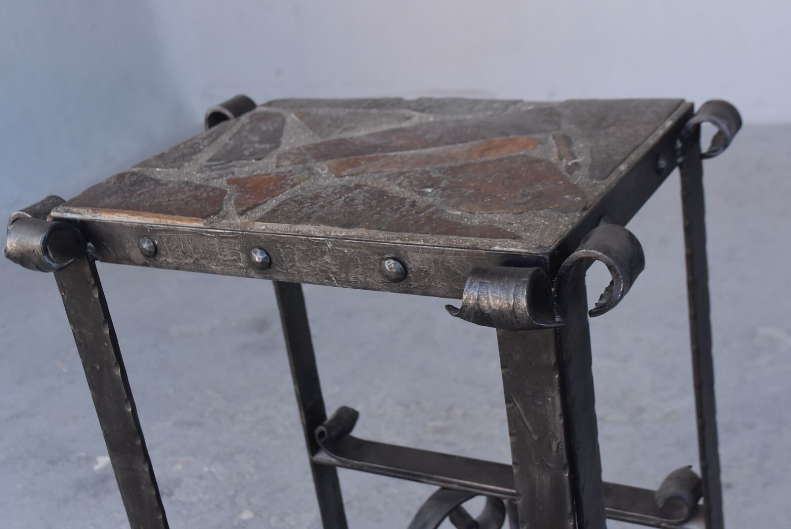 Pair of wrought iron and lava stone bedsides