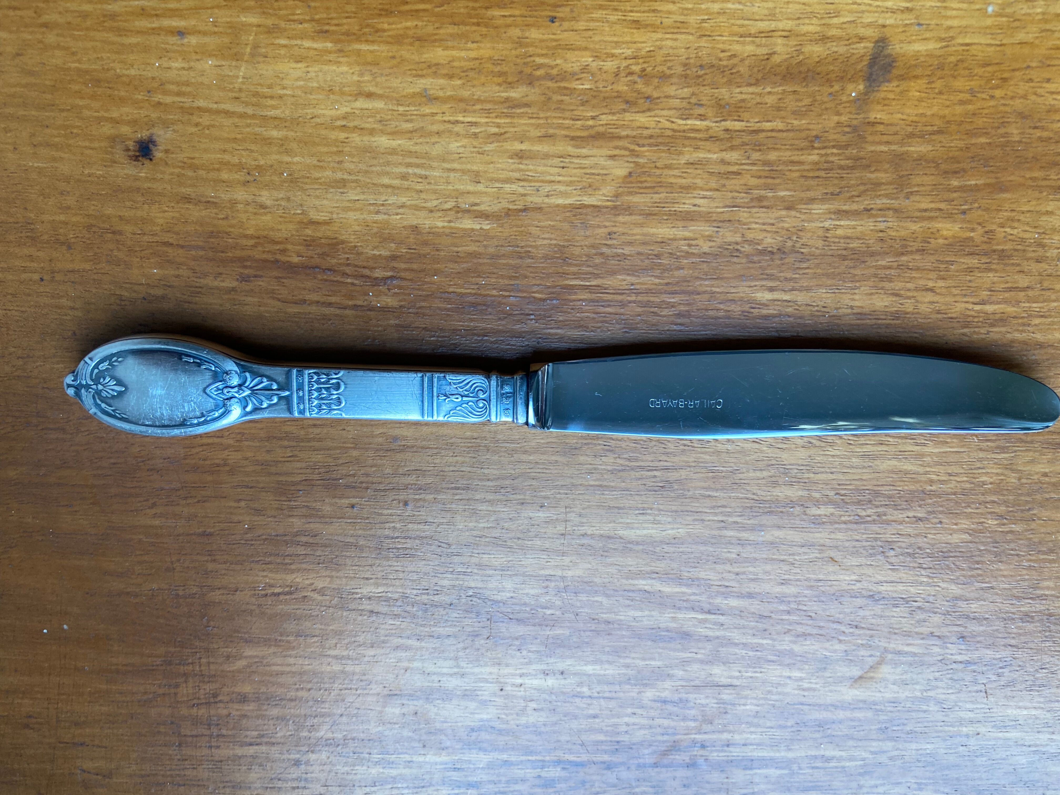 Old silver metal paper cutter