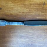 Old silver metal paper cutter