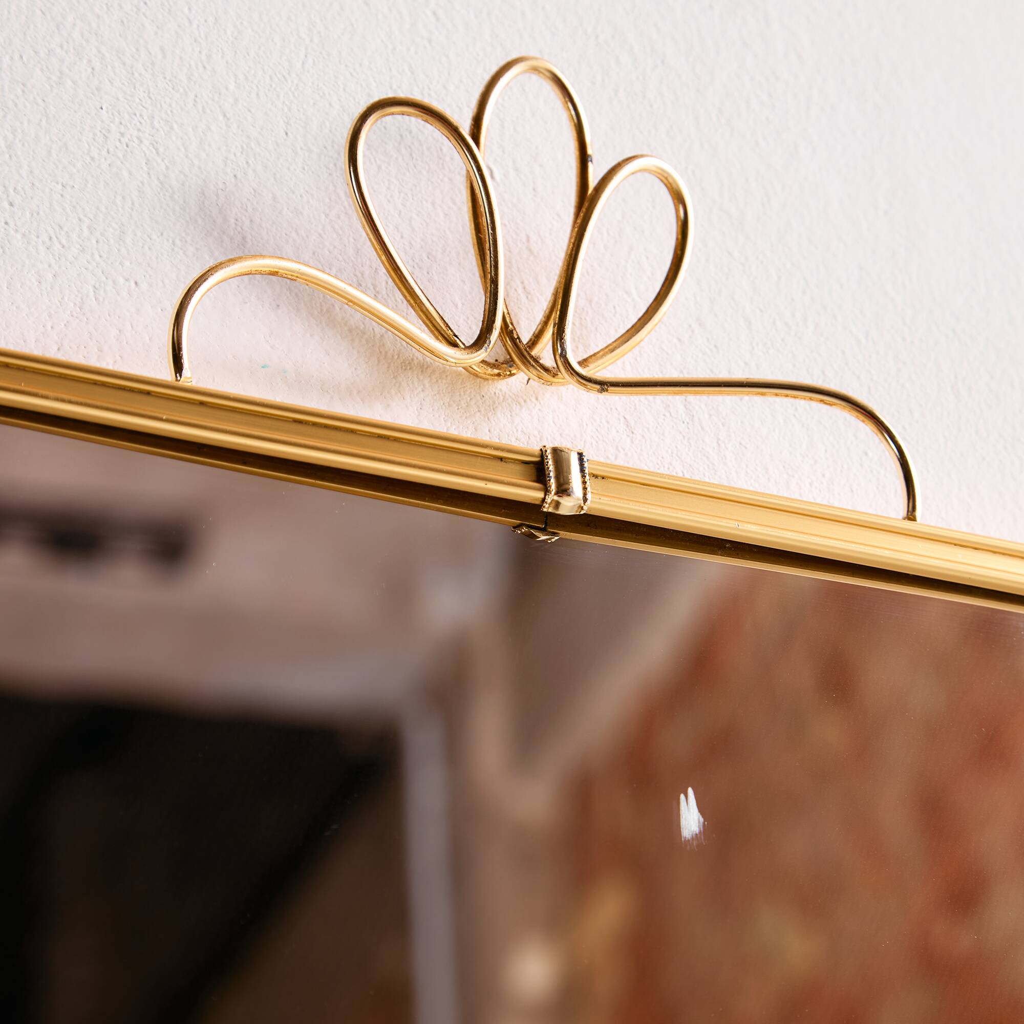 Metal and brass framed mirror
