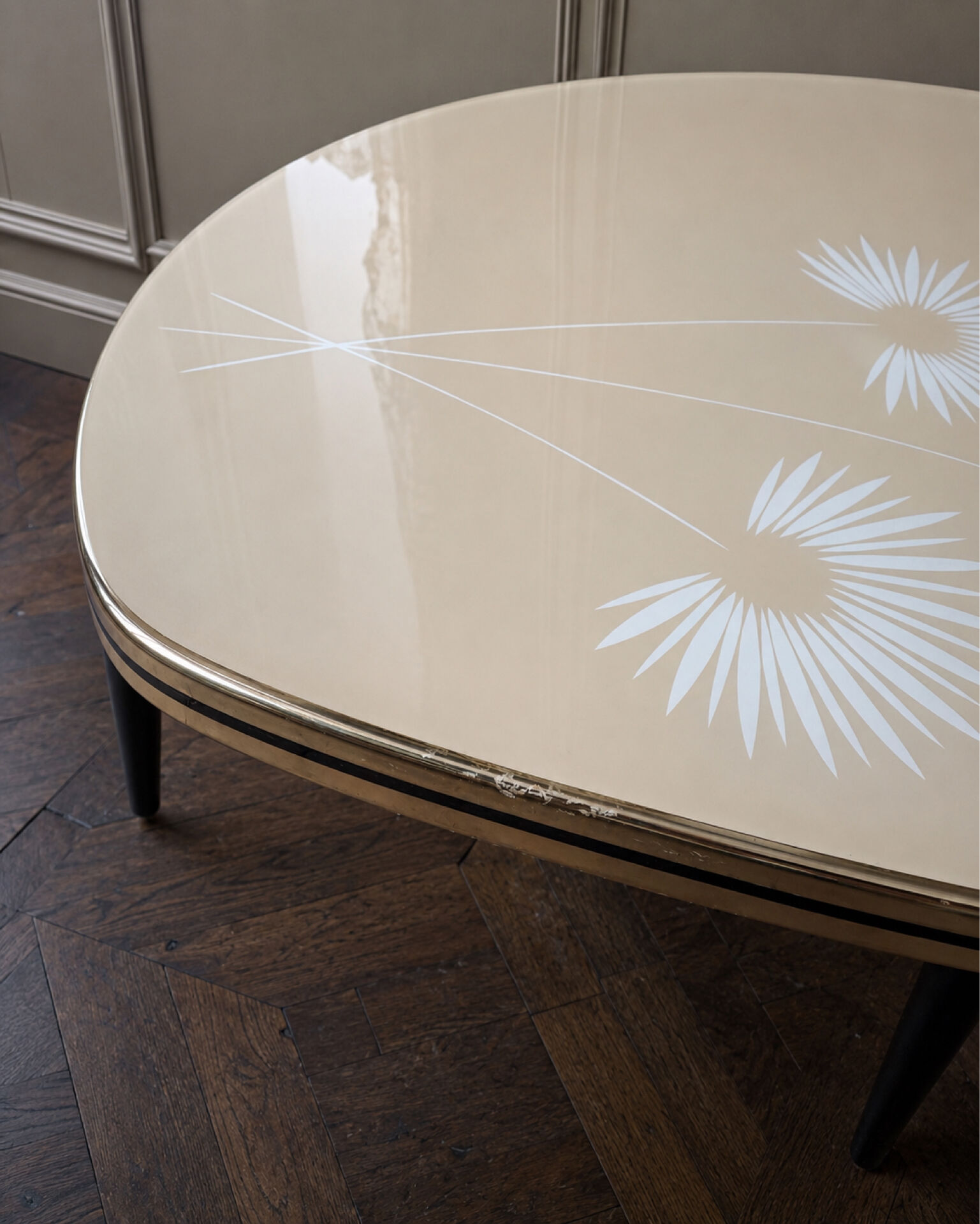 Tripod coffee table with floral design from the 1950s in brass metal and decorative top.