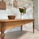 Vintage farmhouse table with turned legs.