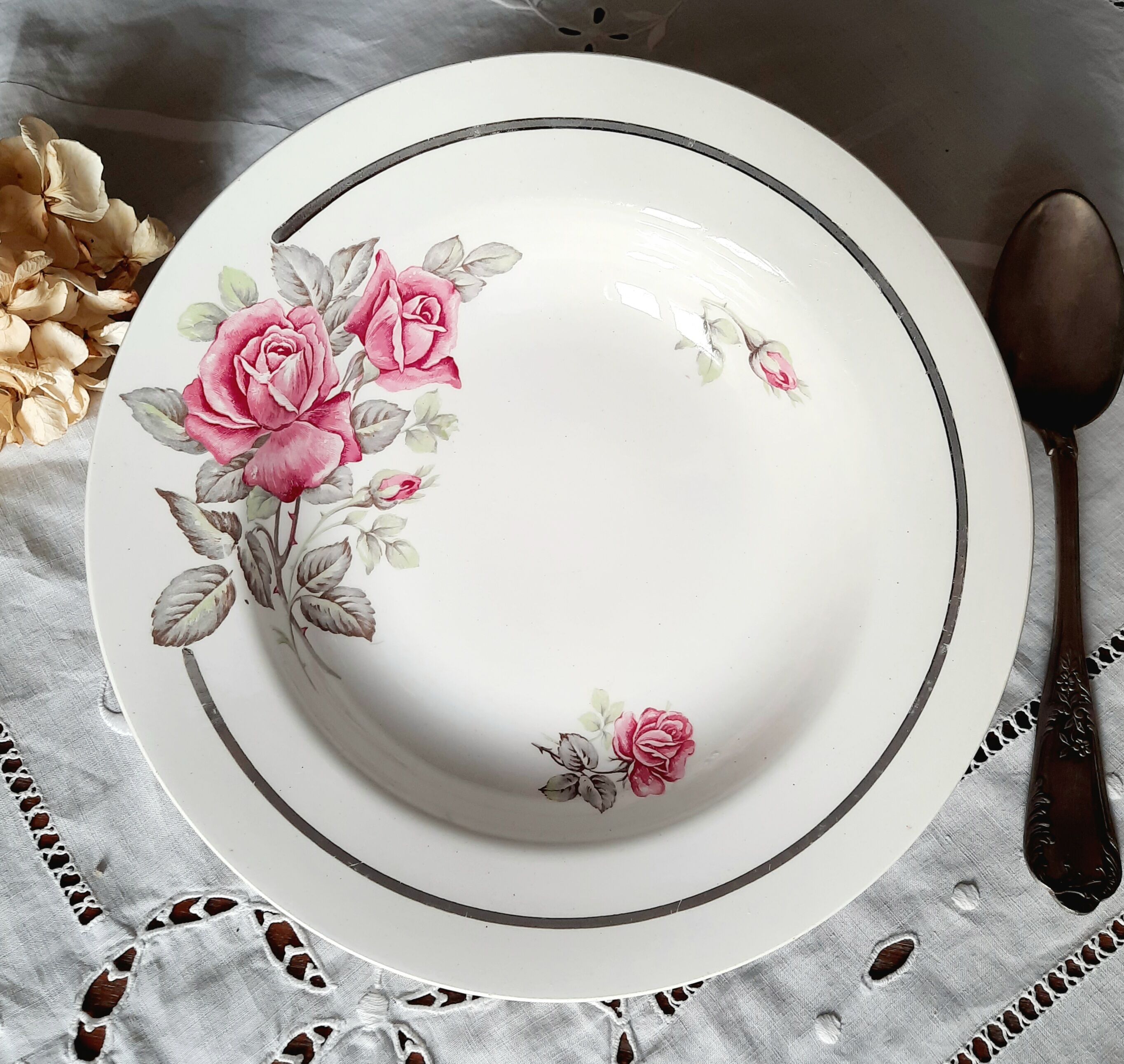 Old hollow plates mismatched in earthenware with gilded edges