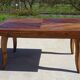 Antique solid walnut table with marquetry and extensions.