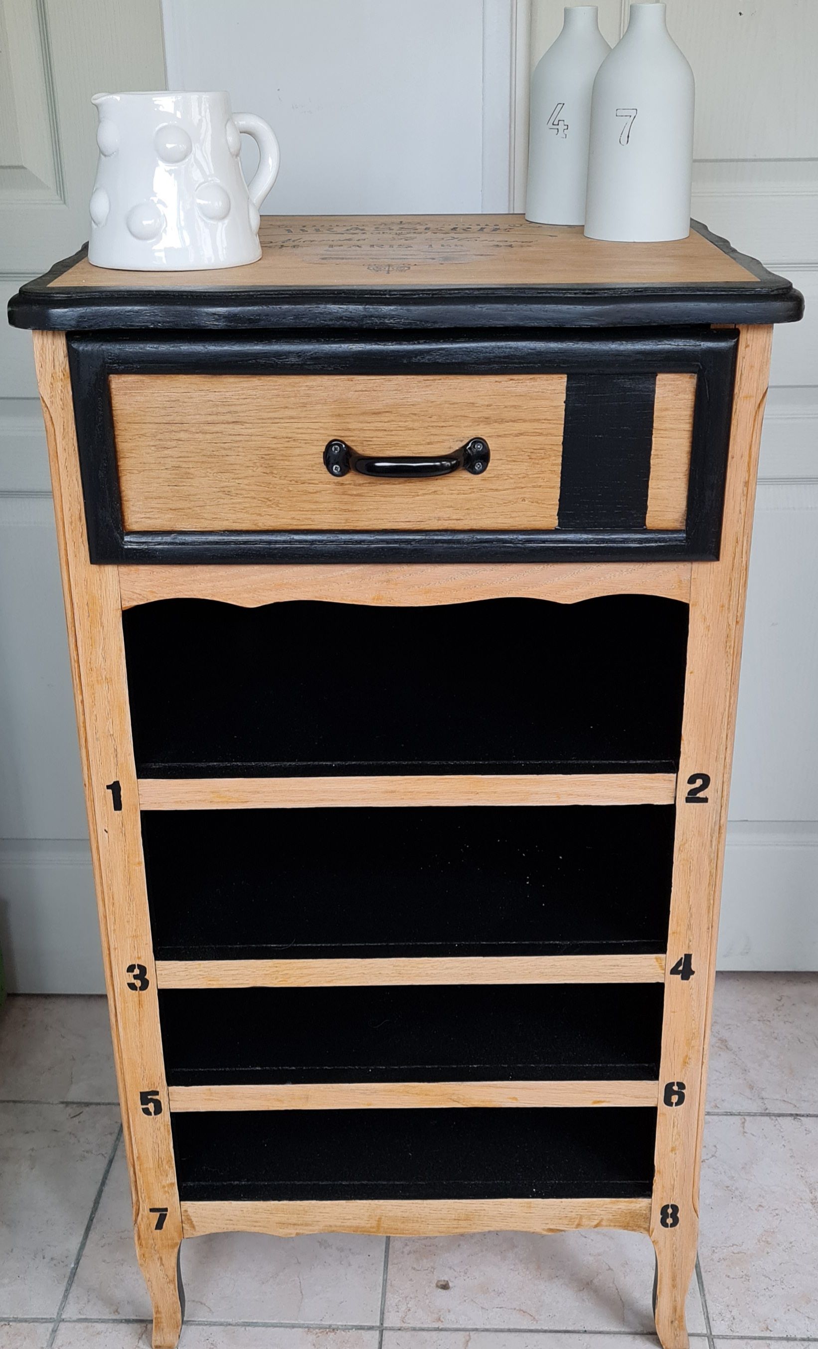 Raw oak and matte black storage cabinet on stencil top and transfer