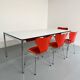 Large table design USM Haller with a white top and chrome structure.