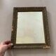Old stitched golden mirror
