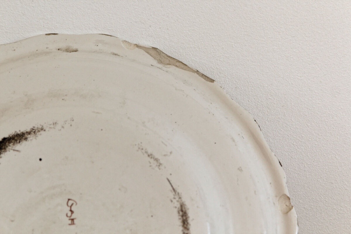 Signed Moustiers plate, in yellow shades